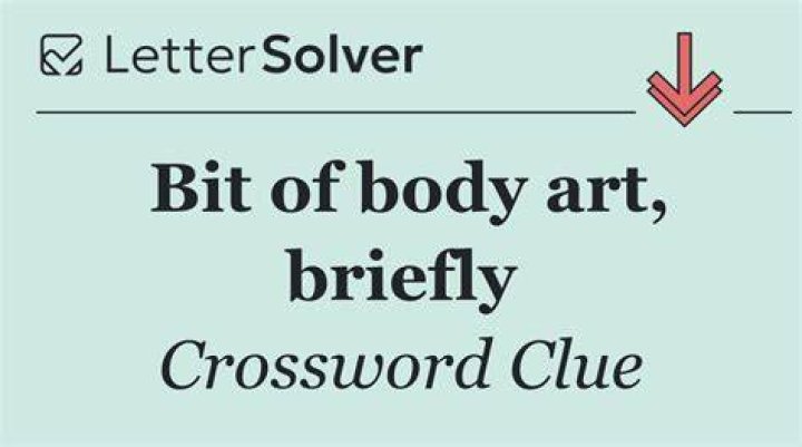 Bit of body ink Crossword Clue