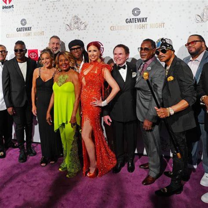 Celeb’s red-carpet companion, perhaps Crossword Clue