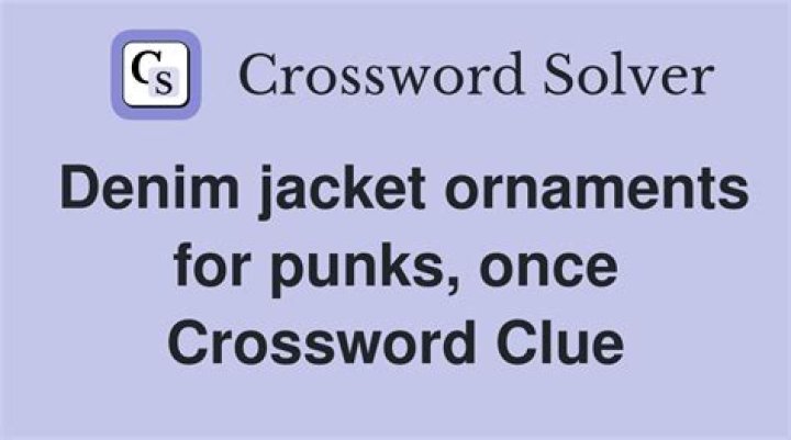 Denim jacket adornment Crossword Clue