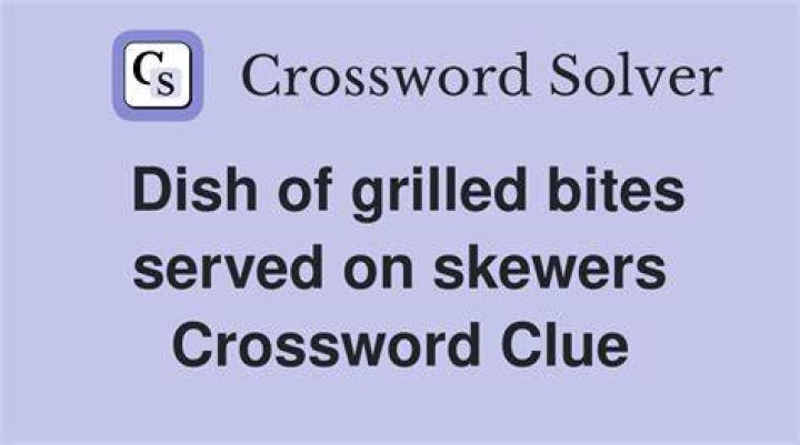 Dish served on a skewer Crossword Clue