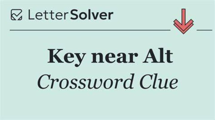 Key near “~” Crossword Clue