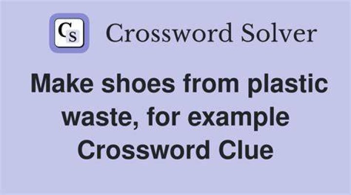 Plastic-like clogs Crossword Clue