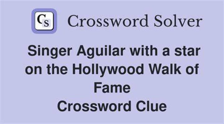 Singer profiled in the biopic “Walk the Line” Crossword Clue
