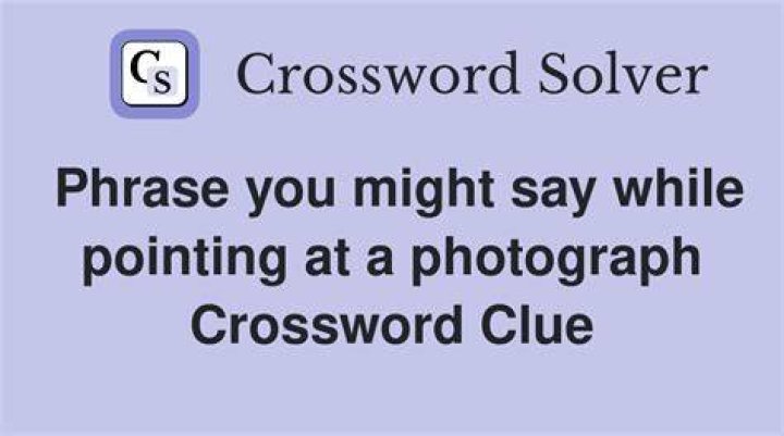 Word that might be said while pointing Crossword Clue