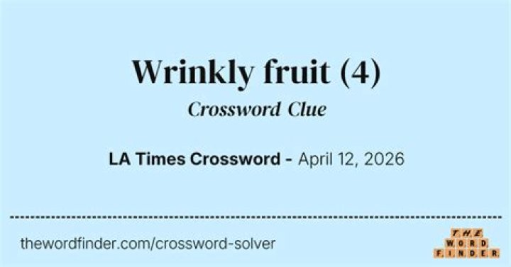 Wrinkly-skinned fruit Crossword Clue